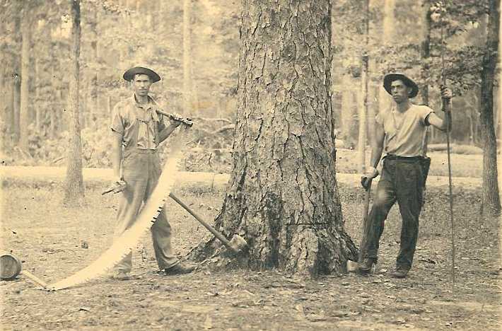 Andrew Ingram holding the saw on the left