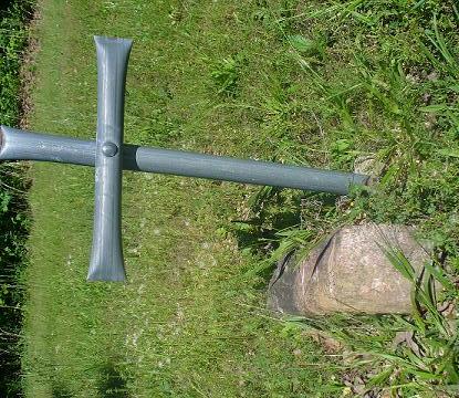 Most of the crosses are gray, only one white cross.