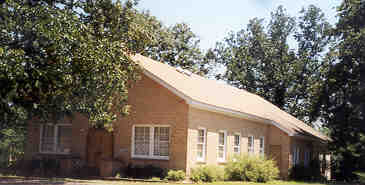 The First Baptist Church on the hill opposite the school. A fellowship hall now adjoins to the left.