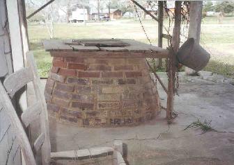 The well on the back porch of the house at White Town, Pencil Bluff, still has water in it.